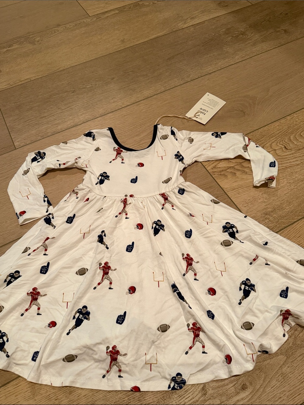Kyte BABY White Football Print Long Sleeve Twirl Dress